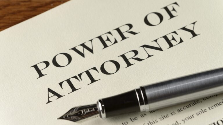Power of attorney document and pen