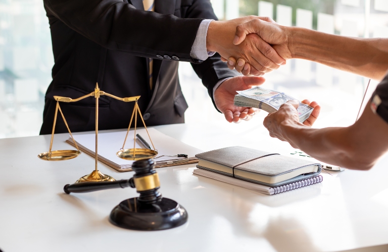 The lawyer shaking, Judge gavel with money